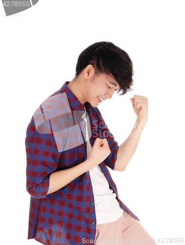 Image of Happy Asian man in checkered shirt.