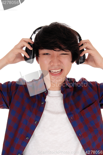 Image of Asian man listen to music.