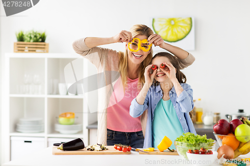 Image of happy family cooking dinner at home kitchen