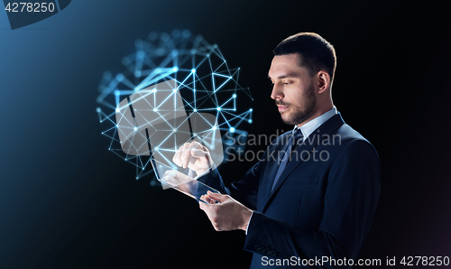 Image of businessman with tablet pc and network projection