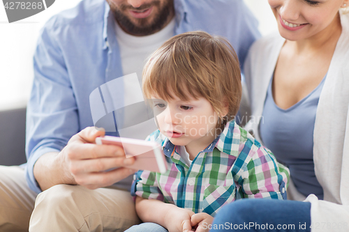 Image of happy family with smartphone at home