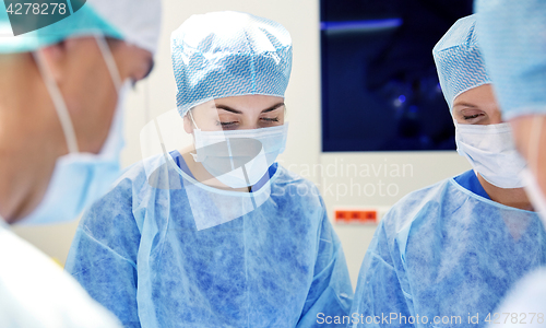 Image of group of surgeons in operating room at hospital