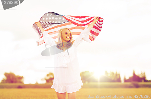 Image of happy woman with american flag on cereal field