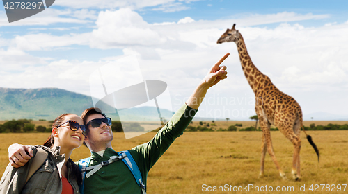 Image of happy couple with backpacks traveling in africa