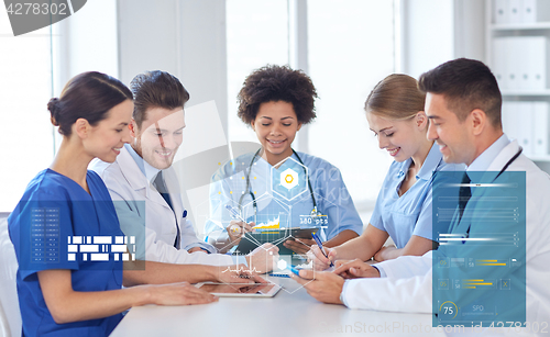 Image of group of happy doctors meeting at hospital office
