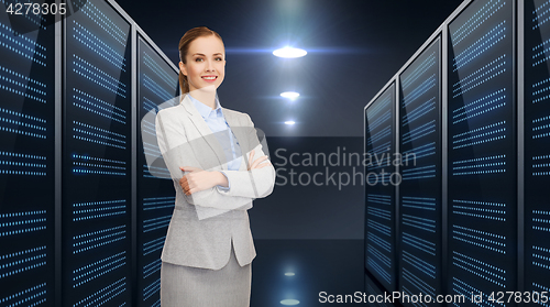 Image of businessman over server room background