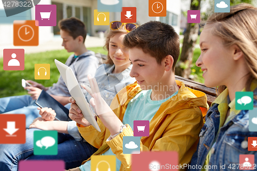 Image of happy friends with tablet pc computer outdoors