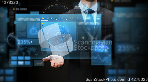 Image of businessman with virtual screens over black