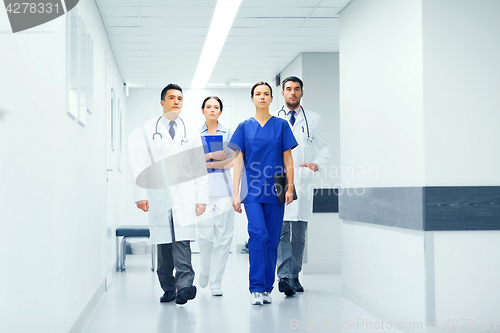 Image of group of medics or doctors at hospital corridor