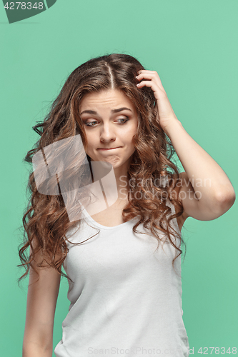 Image of The young woman\'s portrait with thoughtful emotions