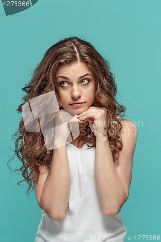 Image of The young woman\'s portrait with thoughtful emotions