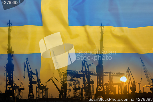 Image of Industrial concept with Sweden flag at sunset