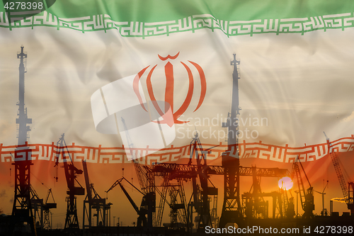 Image of Industrial concept with Iran flag at sunset