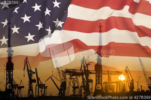 Image of Industrial concept with United States flag at sunset