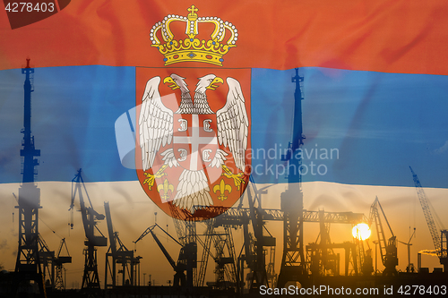 Image of Industrial concept with Serbia flag at sunset