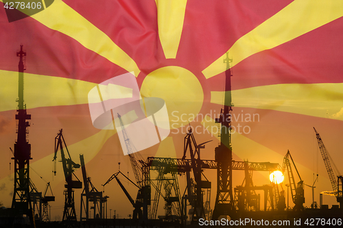 Image of Industrial concept with Macedonia flag at sunset