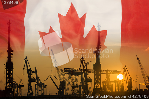 Image of Industrial concept with Canada flag at sunset