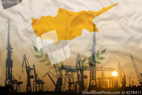 Image of Industrial concept with Cyprus flag at sunset