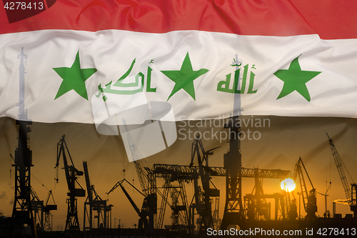 Image of Industrial concept with Iraq flag at sunset