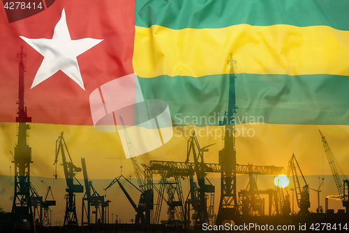 Image of Industrial concept with Togo flag at sunset