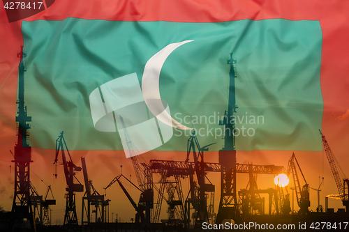 Image of Industrial concept with Maldives flag at sunset
