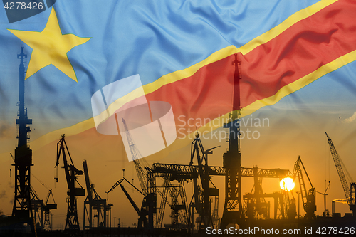 Image of Industrial concept with Congo flag at sunset