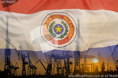 Image of Industrial concept with Paraguay flag at sunset