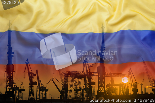 Image of Industrial concept with Colombia flag at sunset