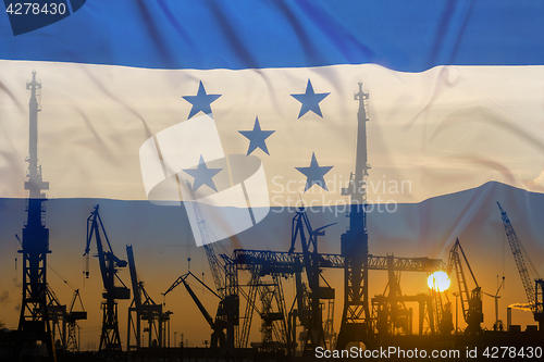 Image of Industrial concept with Honduras flag at sunset