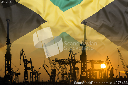Image of Industrial concept with Jamaica flag at sunset