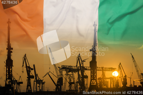 Image of Industrial concept with Ivory Coast flag at sunset