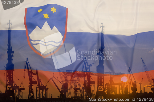 Image of Industrial concept with Slovenia flag at sunset
