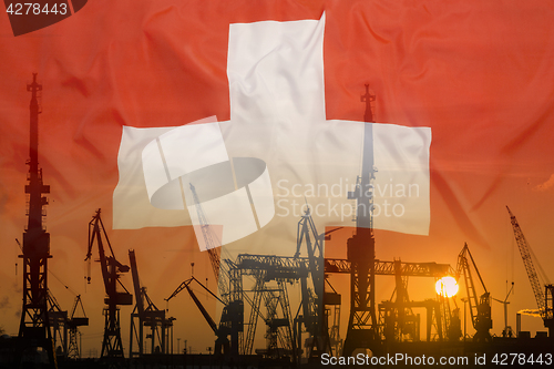 Image of Industrial concept with Switzerland flag at sunset