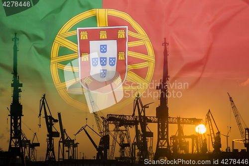 Image of Industrial concept with Portugal flag at sunset