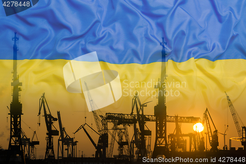 Image of Industrial concept with Ukraine flag at sunset