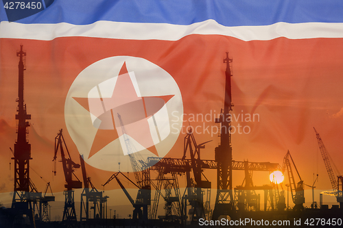 Image of Industrial concept with North Korea flag at sunset