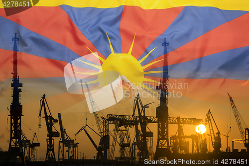 Image of Industrial concept with Tibet flag at sunset