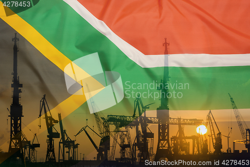 Image of Industrial concept with South Africa flag at sunset