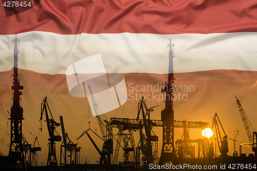 Image of Industrial concept with Latvia flag at sunset