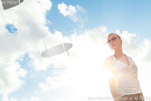 Image of Confident relaxed casual woman enjoying summer.