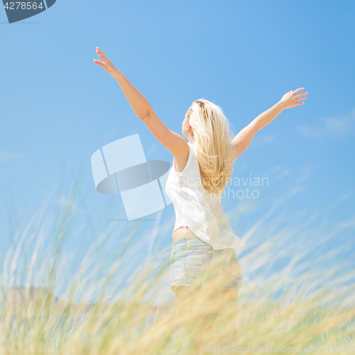 Image of Free Happy Woman Enjoying Sun on Vacations.