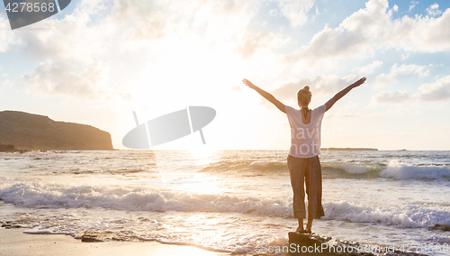 Image of Free Happy Woman Enjoying Sunset on Sandy Beach