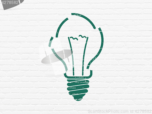 Image of Finance concept: Light Bulb on wall background