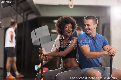 Image of multiethnic couple after workout with hammer