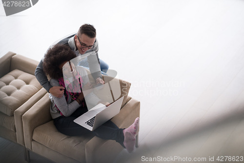 Image of multiethnic couple shopping online