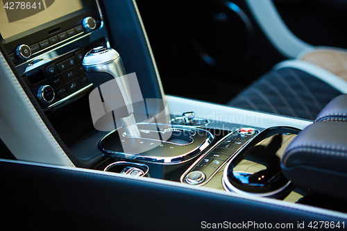 Image of Detail of modern car interior, gear stick.