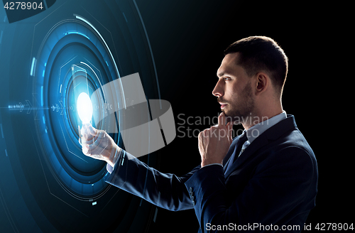 Image of businessman working with transparent tablet pc