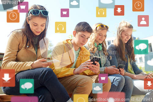 Image of teenage friends with smartphone and headphones
