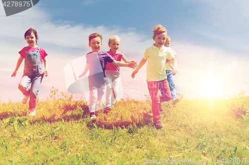 Image of group of happy kids running outdoors