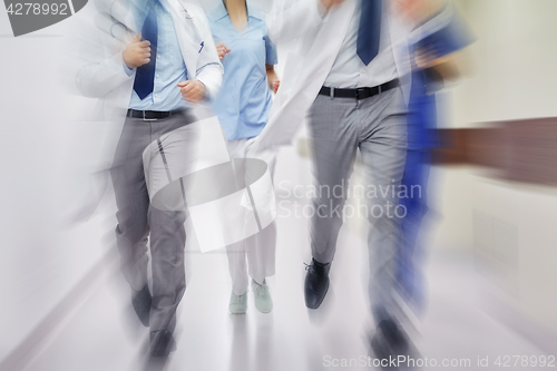 Image of close up of medics or doctors running at hospital